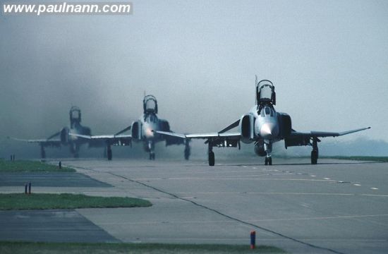 Three F-4s on the runway