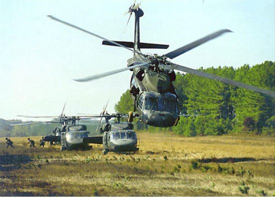 Group of UH-60 Black Hawks transporting troops