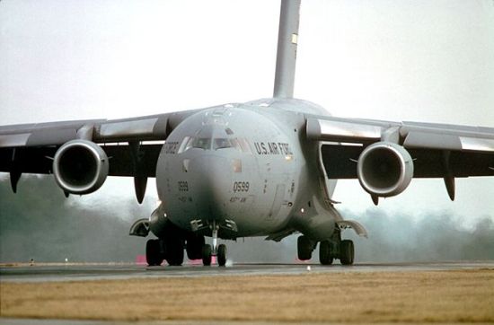 Large vortex generator plates visible on the engine cowlings of a C-17