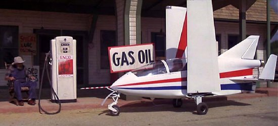 The plane rolls to a stop at a gas station concluding the film's opening sequence