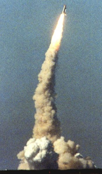 Space Shuttle rolling and pitching to new attitude during launch