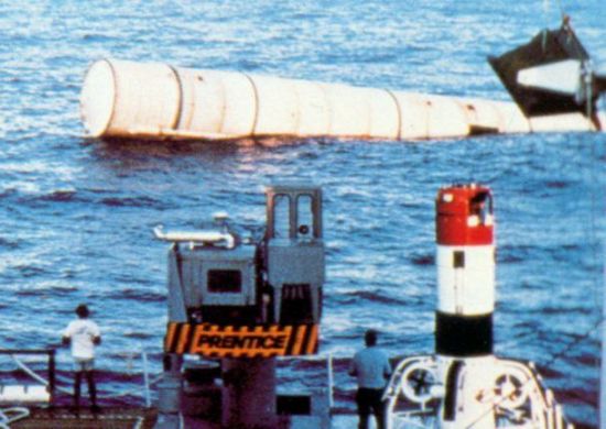 Solid Rocket Booster being recovered at sea