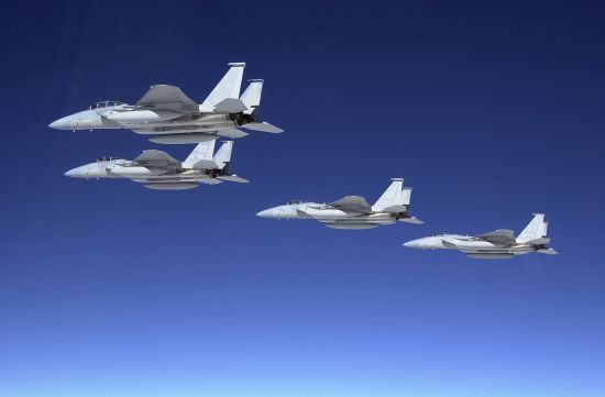 Group of F-15 fighters configured for a long-range ferry mission