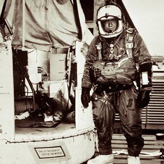 Kittinger wearing his heavy gear standing next to the Excelsior gondola